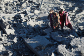 Site of an Israeli strike on a house, amid the Israel-Hamas conflict, in Al Maghazi refugee camp in the central Gaza Strip