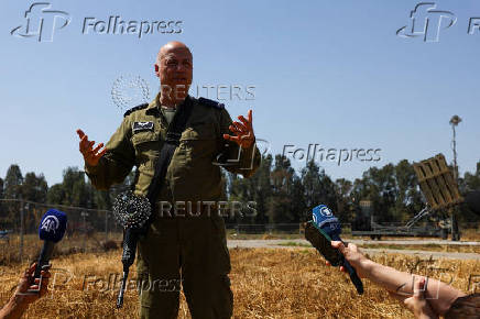 Military reservist Brigadier General Doron Gavish speaks during a press briefing, near Ashkelon