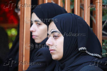 Palestinians mourn loved ones killed in Israeli strikes, in Khan Younis in the southern Gaza Strip