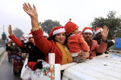 Pakistan's Christian minority dressed up as Santa hold rally in Peshawar