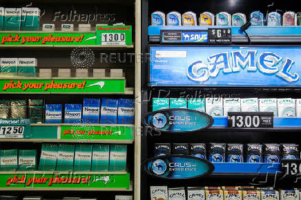 FILE PHOTO: Newport and Camel cigarettes are stacked on a shelf inside a tobacco store in New York