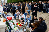 Fans gather and place tributes to former One Direction singer Liam Payne in Paris