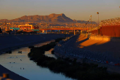 Razor wire fence to inhibit the crossing of migrants into the United States is seen along the bank of the Rio Bravo River, as seen from Ciudad Juarez