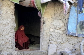 Afghans living in a camp amidst drop in temperatures in Kabul