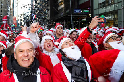 Revellers take part in SantaCon in New York City