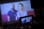 The family of Hersh Goldberg-Polin appears on a screen via video link during a news conference in Tel Aviv