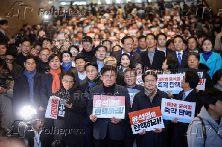 Lawmakers gather to block South Korean President Yoon Suk Yeol from entering the National Assembly in Seoul