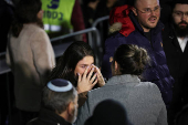 Mourners attend the funeral of Israeli rabbi, Zvi Kogan, in Kfar Habad