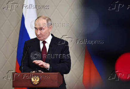 Russian President Putin attends a press conference in Astana