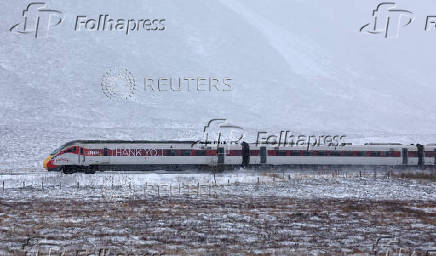 The Inverness to London train makes its way through the Drumochter pass, Scotland