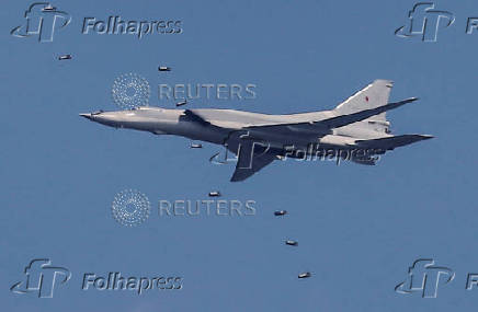 FILE PHOTO: A Tupolev Tu-22M3 strategic bomber drops bombs during the Aviadarts competition at the Dubrovichi range outside Ryazan