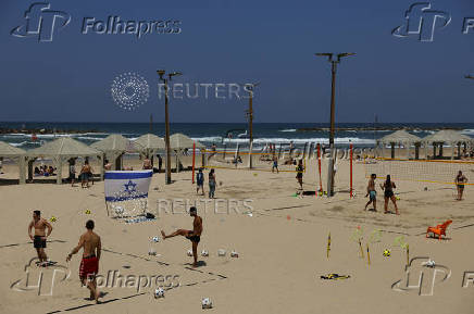 People spend time on the beach, in Tel Aviv,