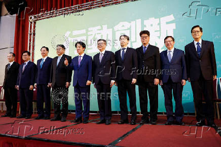 Taiwan President-elect Lai Ching-te gives a thumbs up during a press conference, in Taipei