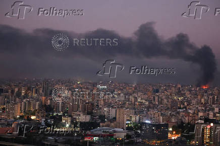 Smoke billows over Beirut's southern suburbs, as seen from Sin El Fil