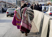 People make their way as they attempt to cross into Lebanon at the Masnaa border crossing between the Lebanon and Syria