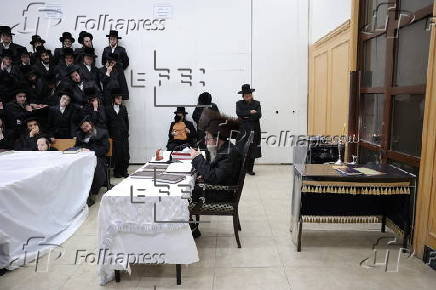 Ultra Orthodox Jews light Hanukkah holiday candles in Jerusalem