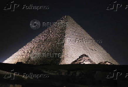 Giza Pyramids are lit up for World Tourism Day on the outskirts of Cairo