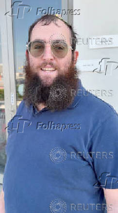 Zvi Kogan, an Israeli rabbi, stands outside a supermarket, in Dubai