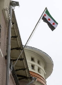 Syrian Embassy in Moscow flies the Syrian opposition flag