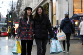 Shoppers walk on Oxford Street in London