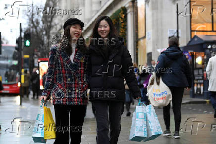 Shoppers walk on Oxford Street in London