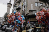 Men sell balloons, after Syria's Bashar al-Assad was ousted, at the downtown of Damascus