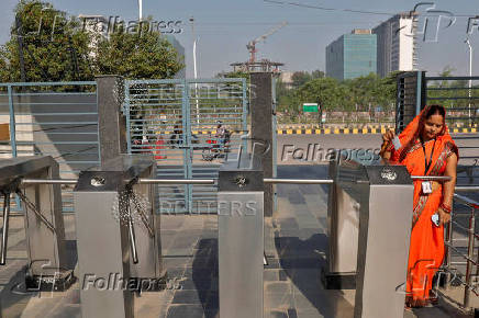 An employee arrives for work at an HCLTech office on the outskirts of Lucknow