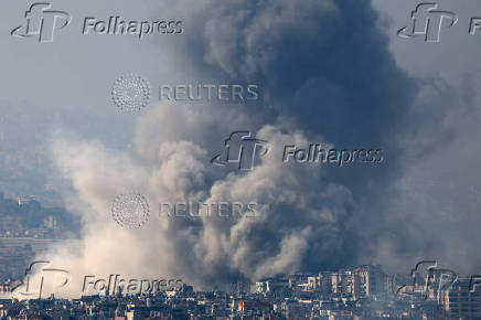 Smoke rises over Beirut's southern suburbs after a strike, amid ongoing hostilities between Hezbollah and Israeli forces