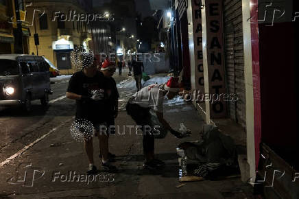 Anjos da Noite (Night Angels) NGO distributes food to homeless people on Christmas Eve in Sao Paulo