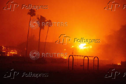 Palisades Fire burns during a windstorm on the west side of Los Angeles