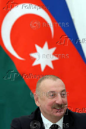Russian President Putin and Azeri President Aliyev meet with railway workers in Moscow