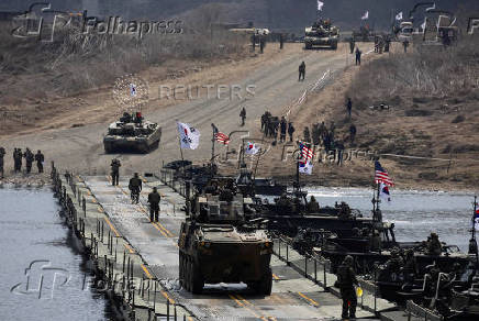 FILE PHOTO: South Korean and US soldiers conduct a joint river-crossing  exercise in Yeoncheon