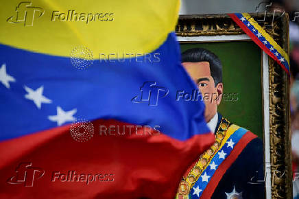 Government supporters participate in a march in support of Venezuelan President Nicolas Maduro's victory in the July 28 elections, in Caracas