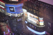 People gather at Times Square to watch the ball drop on New Year's Eve in New York City