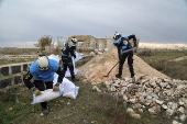 Syrian Civil Defense team clears unexploded ordnance in Idlib countryside