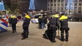 Policemen stand guard after youth clashed with Israeli football supporters, in Amsterdam