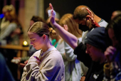 Worshipers at Blackhawk Church gather to pray for victims and survivors of a shooting in Madison