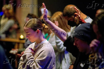 Worshipers at Blackhawk Church gather to pray for victims and survivors of a shooting in Madison