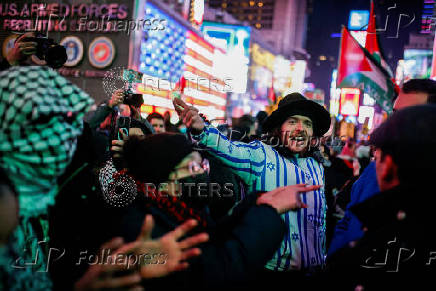 Pro-Palestinian protesters rally to stand with Palestinians in Gaza following the announcement of the ceasefire, in New York