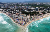 A drone view shows people enjoying the Macumba beach, during a heatwave in Rio de Janeiro