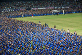 Participants wearing colourful attire, perform Bharatanatyam dance at the Jawaharlal Nehru International Stadium, in Kochi