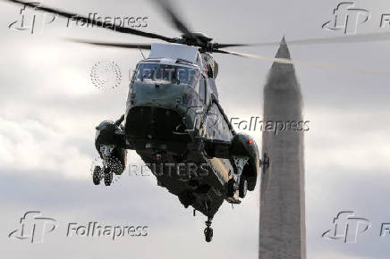 U.S. President Joe Biden and Jill Biden arrive on the South Lawn of the White House