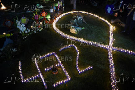 Demonstrators hold a vigil ahead of International Day for the Elimination of Violence Against Women, in Guatemala City