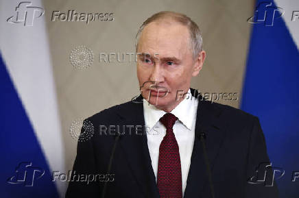 Russian President Putin attends a press conference in Astana