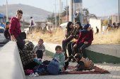 People make their way as they attempt to cross into Lebanon at the Masnaa border crossing between the Lebanon and Syria