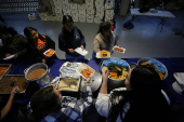 Migrants participate in a Posada ahead of Christmas, in Tijuana