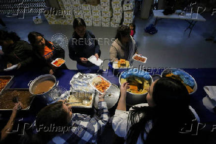 Migrants participate in a Posada ahead of Christmas, in Tijuana