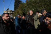 Former members of Syria's Bashar Al Assad's security forces wait to register for the identification and reconciliation process, in Damascus