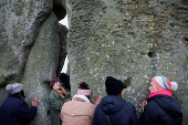 Revellers attend winter solstice celebrations at Stonehenge stone circle near Amesbury