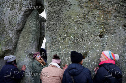 Revellers attend winter solstice celebrations at Stonehenge stone circle near Amesbury